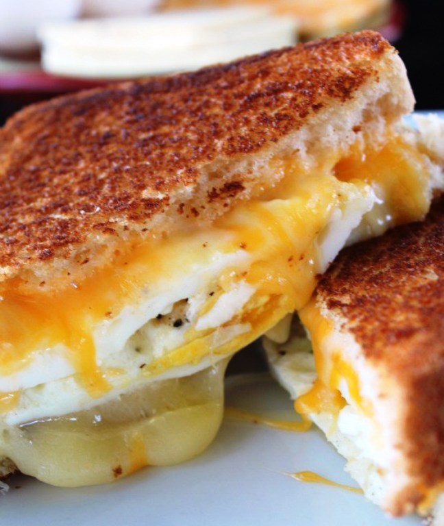  Fried egg sandwich and a grilled cheese 