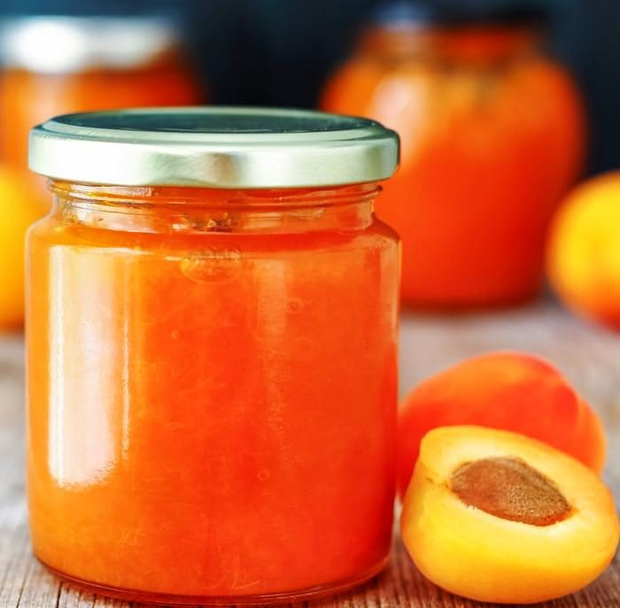 This small batch low sugar apricot jam is made from scratch and is pectin free! Use it as apricot glaze on cakes or simply spread on toast.