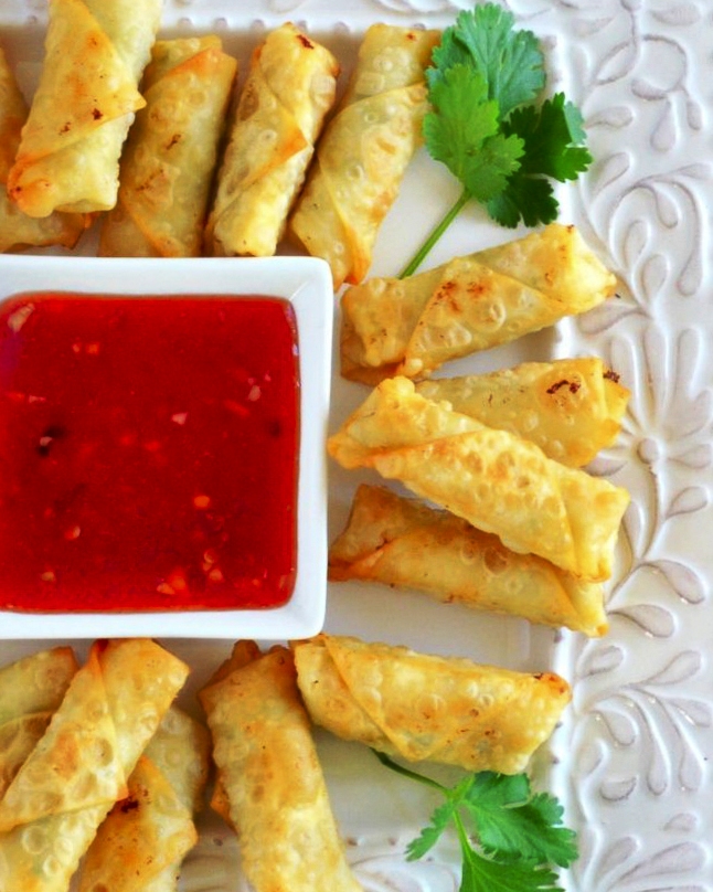 Mini Shrimp Rolls are crisp little appetizers filled with tender shrimp, fresh ginger, and spring onion, served with a tangy homemade plum sauce.