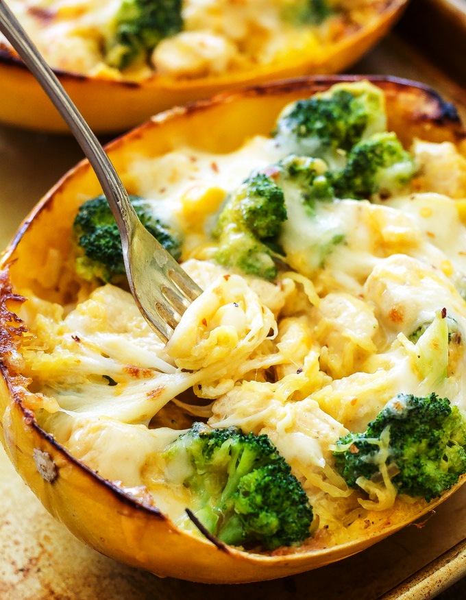 Spaghetti Squash stuffed with a creamy, cheesy, chicken and broccoli filling and topped with more melted cheese.