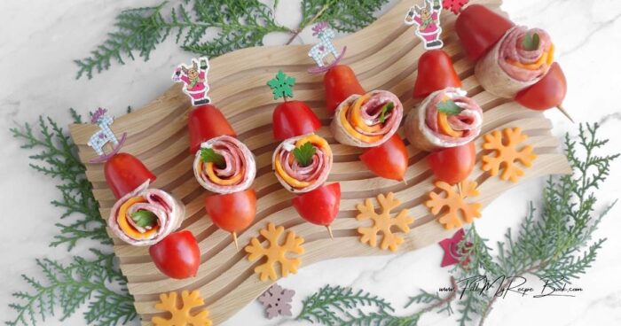 Make these festive Holiday Pinwheel Snack Skewers in just 10 minutes! Whole-wheat tortillas, salami, cheddar, and cream cheese for easy appetizers.