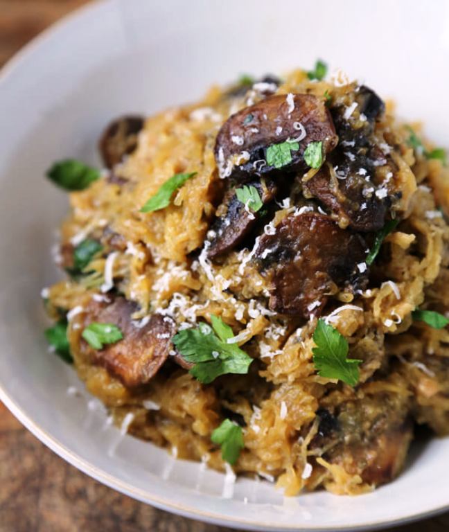 This comforting roasted spaghetti squash with mushrooms, garlic, and parmesan, is a quick and easy low carb meal to serve on a busy weeknight, or as part of a festive celebration dinner.