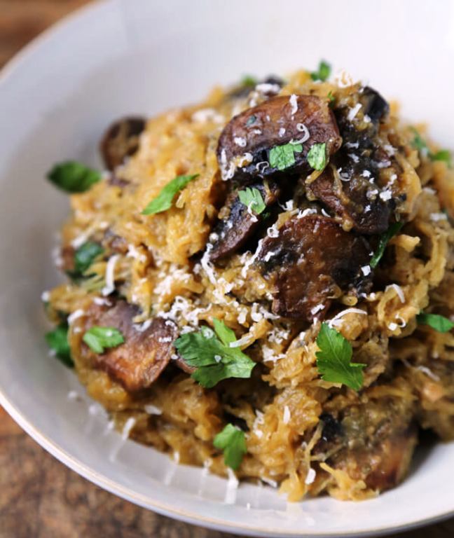 This comforting roasted spaghetti squash with mushrooms, garlic, and parmesan, is a quick and easy low carb meal to serve on a busy weeknight, or as part of a festive celebration dinner. 