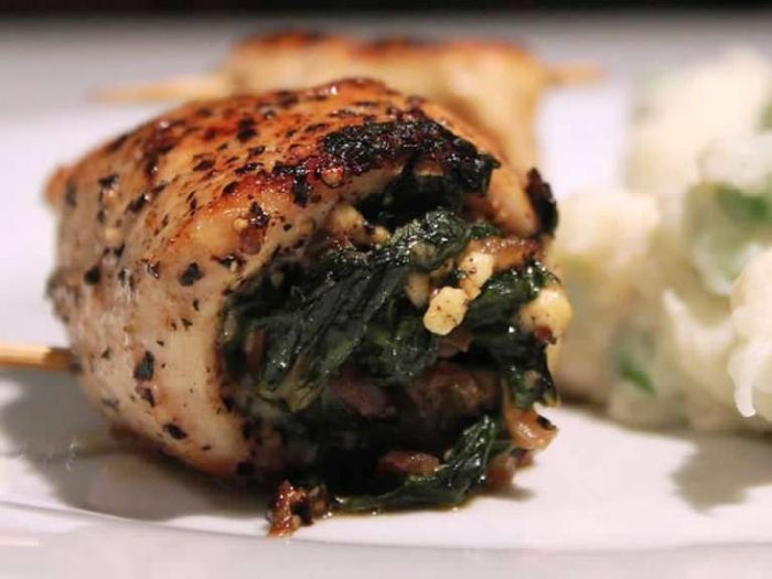 Stuffing spinach into chicken 