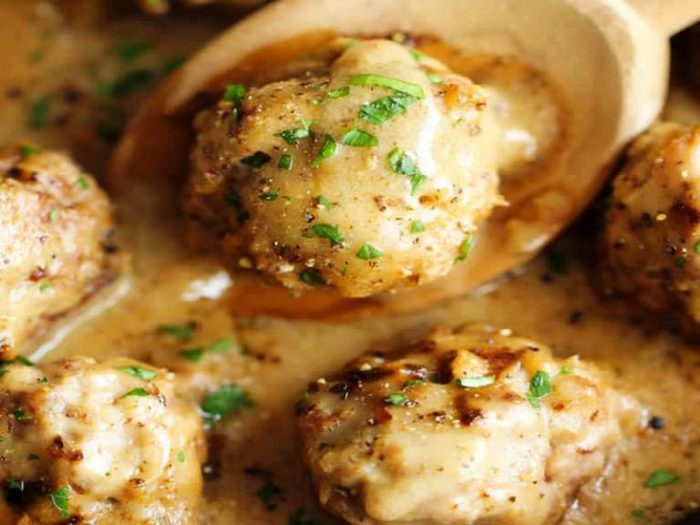 Homemade meatballs smothered in a creamy gravy sauce.
