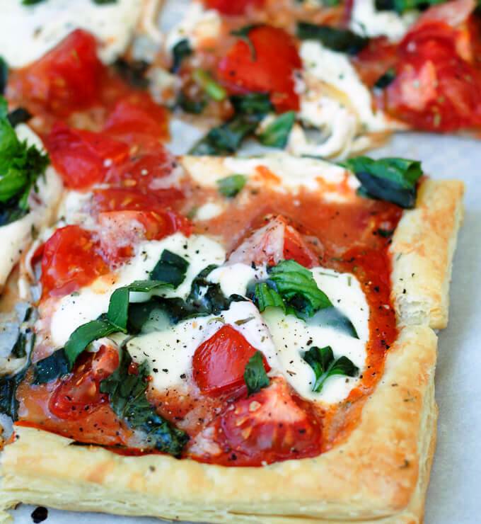 This Tomato Basil Mozzarella Puff Pastry Tart recipe is an easy, Summer-y, and savory meal to make. No pizza dough-making is required!