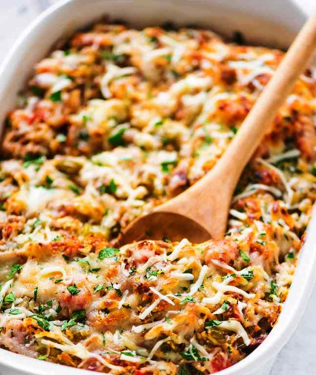 It’s a comfort food to the rescue day! I have an easy, cheesy, and low-carb healthy Spaghetti Squash Casserole recipe for you. Whether you are looking for a meal to match your cozy night on the couch…or are already anticipating the week of easy, healthy dinners you are going to need after the weekend, this casserole has you covered!