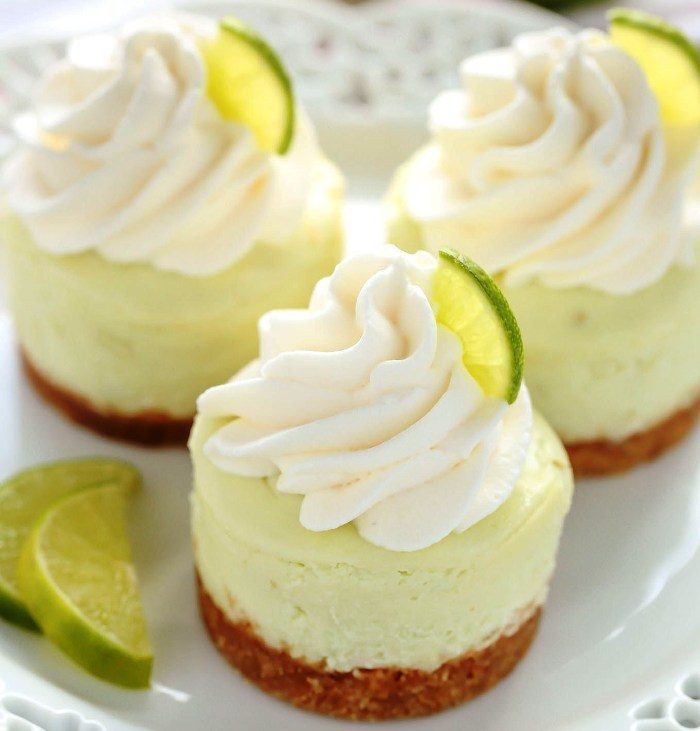 These Mini Key Lime Cheesecakes feature an easy homemade graham cracker crust topped with a smooth and creamy key lime cheesecake filling.