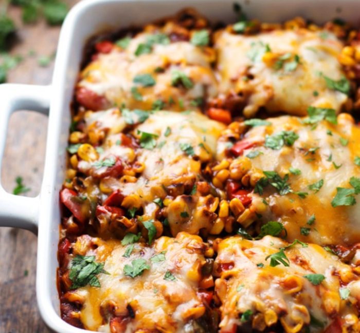 This Healthy Mexican Casserole has roasted corn, roasted bell peppers, cheese, enchilada sauce, and corn tortillas. Perfect leftovers for lunches!