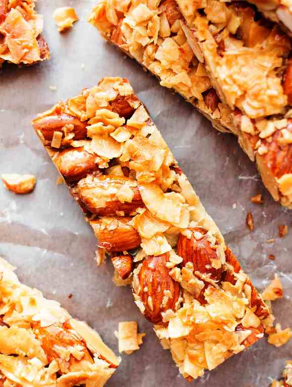 The easiest kind bars, coconut and almond flavored. just 3 ingredients for chewy, crunchy, healthy coconut almond bars.
