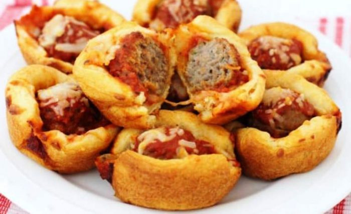 Cheesy Meatball appetizer bites made with crescent dough, frozen meatballs, marinara sauce and lots of cheese! Easy meatball appetizer recipe perfect for parties & game day.
