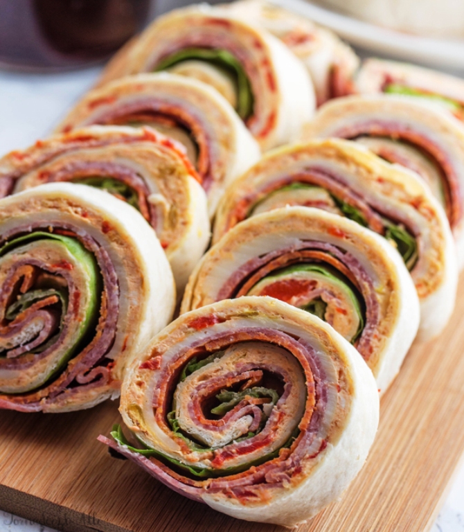 A deliciously fun appetizer for your game day, holiday or party needs, these Italian Pinwheels are tasty, fast and a fun addition to your meal!