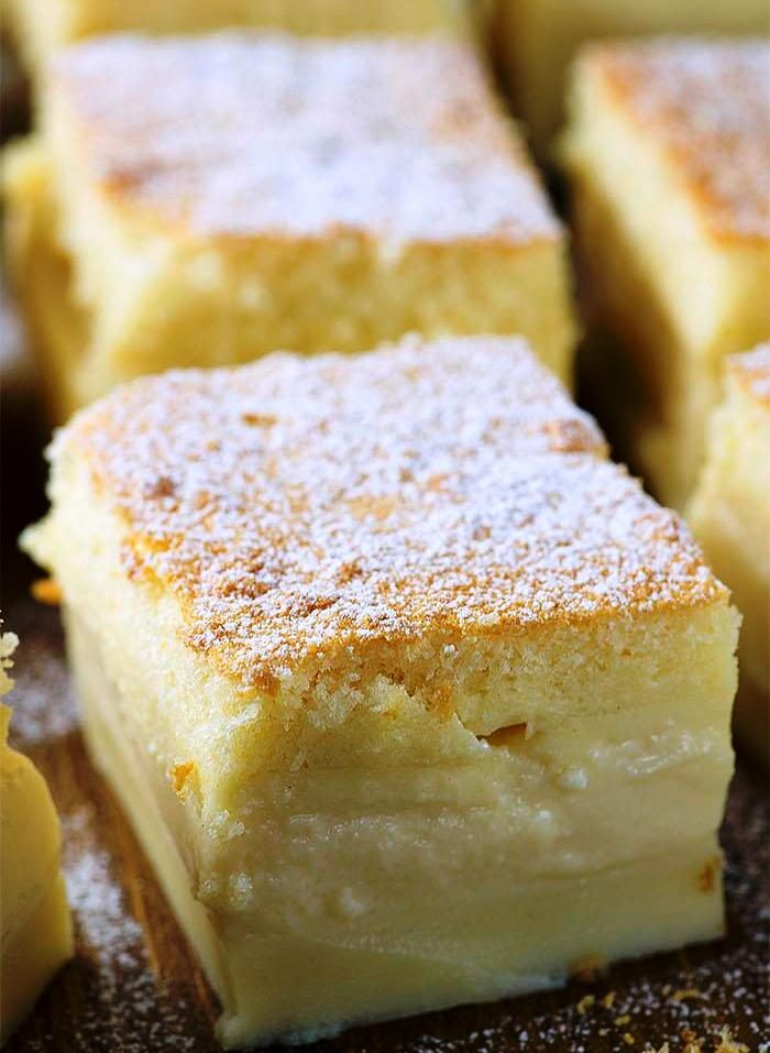 A custard-like vanilla filling separates a light, fluffy layer on top and a dense cake layer on the bottom, to create the ultimate vanilla cake recipe.