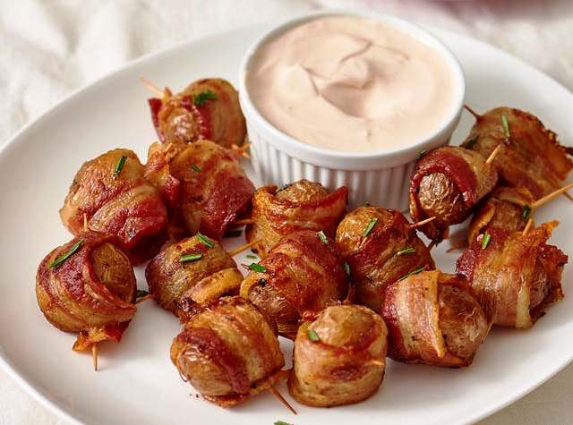 These potato bites are easy, delicious, and perfect for a sports-loving crowd, should you find yourself surrounded by one this weekend. They even remind us of sports-bar food, like little deconstructed potato skins.