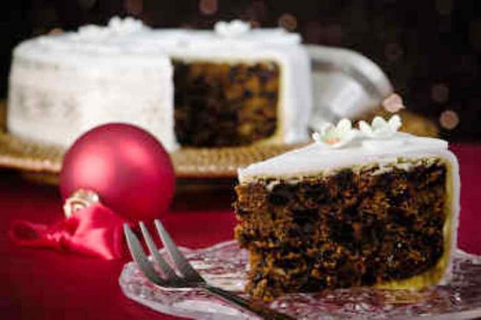 Here's a recipe for a delicious, traditional Christmas cake. It's bursting with dried fruit and covered with marzipan and fondant icing. As with all Christmas cakes, this one improves with keeping. You should aim to make it at least a month before Christmas, and up to three months before.