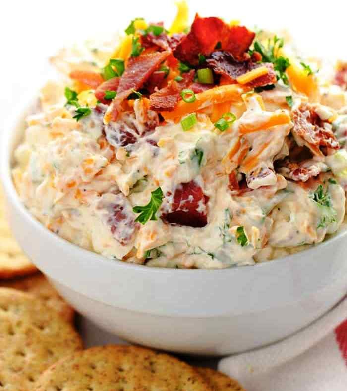 This amazing bacon cheese dip is served cold with loads of bacon and cheddar flavor!  This is the perfect dip for crackers, chips or vegetables!