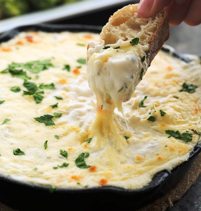 This chicken alfredo dip is out of this world! It’s creamy, cheesy, loaded with chicken, AND made from scratch! It’s perfect for an appetizer or a delicious side dish!