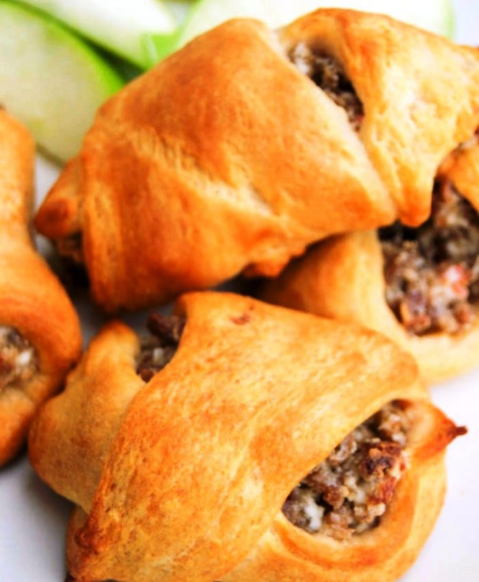 These Cream Cheese Sausage Crescent Roll Ups are so simple to make and one of my family's favorite breakfast recipes. Bold sausage and cream cheese wrapped in a fluffy crescent roll. 