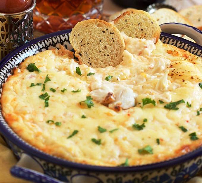 Hot Bacon Cheddar dip is hot, cheesy and loaded with flavor! The perfect party dip for crackers or chips!