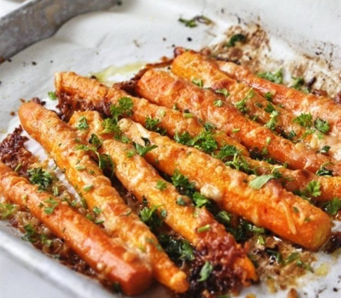 You are going to fall in love with these Parmesan Roasted Carrots.  They are a sure fire way to get the kids and grown-ups to eat their vegetables.