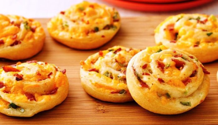 If you ever need an easy, cheesy appetizer for a dinner party, let it be these Bacon-Cheddar Pinwheels!