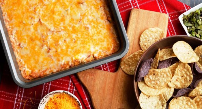 Instantly become everyone’s favorite guest when you show up with a bowl of this Texas trash dip. Perfect for Cinco de Mayo or tailgating, this Mexican-inspired bean dip infuses refried beans with chopped green chiles, taco seasoning, sour cream, cream cheese