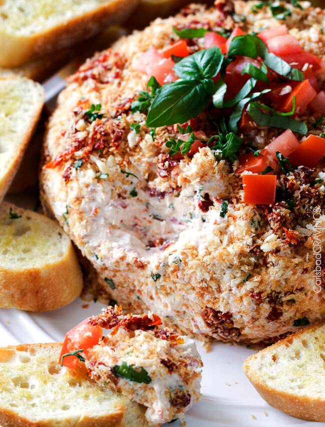 Super easy (make ahead!) Bruschetta Cheese Ball takes just minutes to whip up and is always a total show stopping appetizer! 