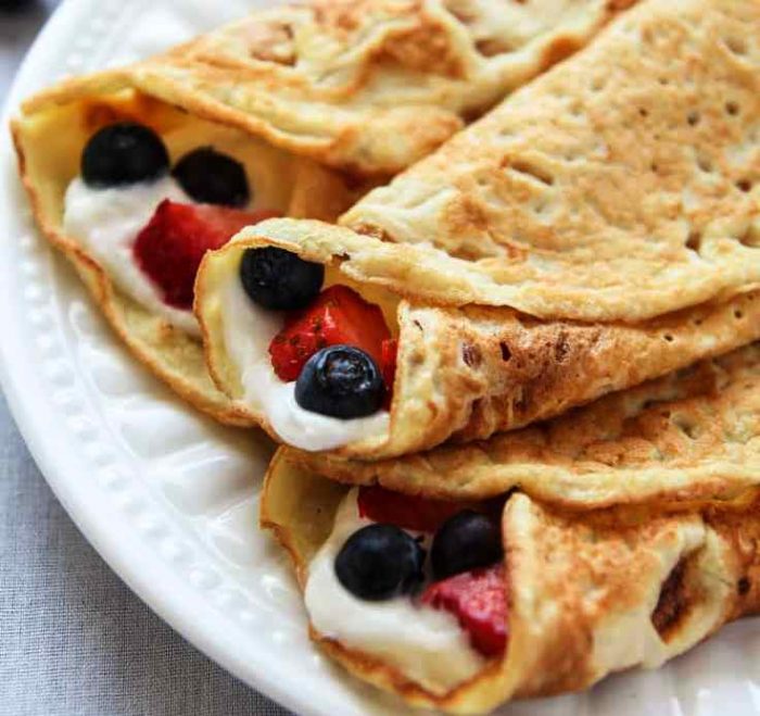 These Coconut Flour Crepes are gluten-free, low-carb and paleo. Add your favorite savoury or sweet fillings like whipped cream and berries for a wholesome treat.