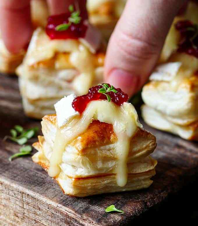 The Cranberry Brie Bites are a simple appetizer or party snack that always gets polished off in minutes!
They're super easy to make only take five simple ingredients and can be ready in 21 minutes! - that's my kind of recipe.