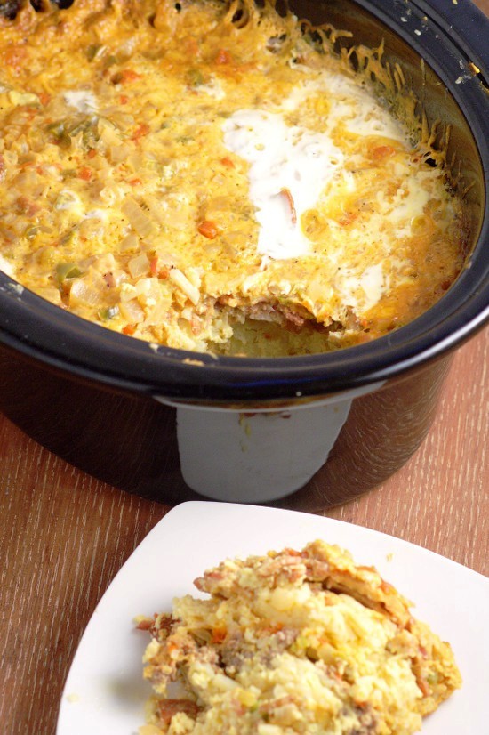 Overnight Crockpot Breakfast Casserole is a classic breakfast casserole with eggs, sausage, bacon, hash browns, and cheese. It's easy to make, great for the holidays and feeding a crowd.