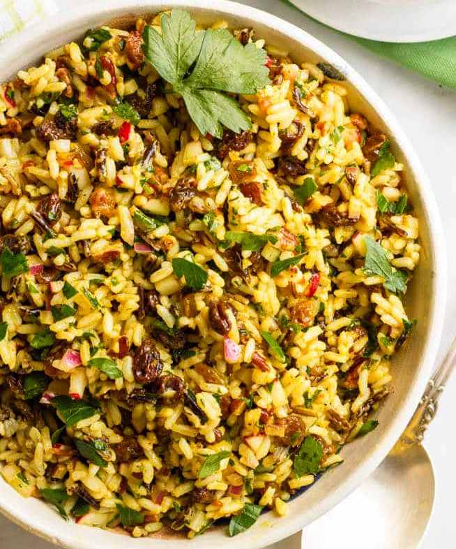 This cold curried wild rice salad with raisins and pecans has amazing flavors and textures and is perfect as a make-ahead dinner side dish or lunch. You’ll be addicted!