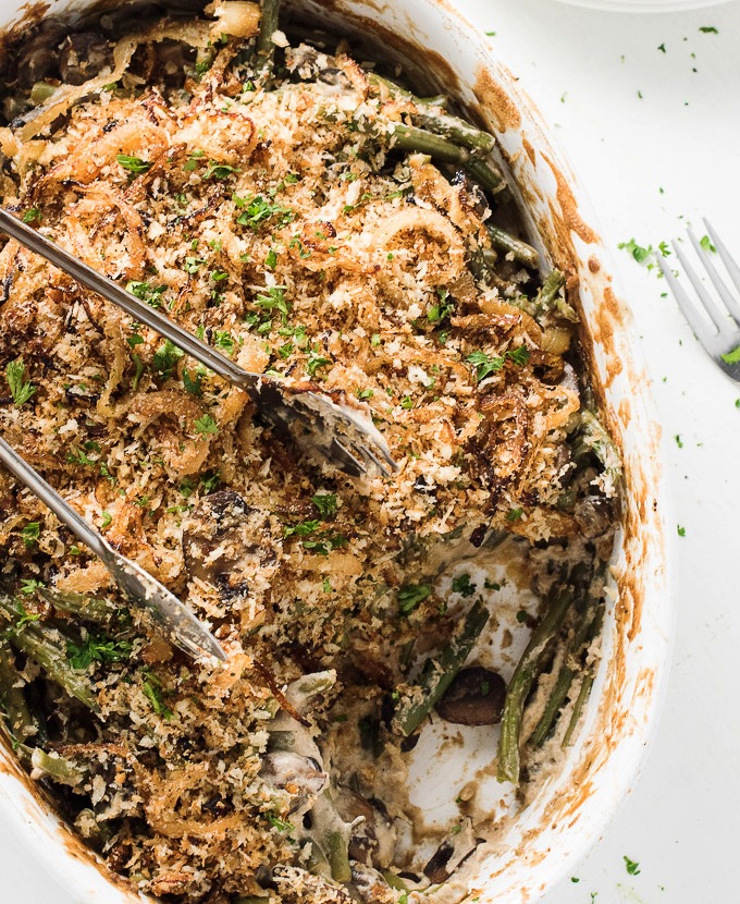 Here's a vegan green bean casserole that's creamy, cozy, and rivals the classic. With a savory mushroom sauce, tender green beans, and a crispy panko topping, it's the perfect holiday side dish that everyone can enjoy.