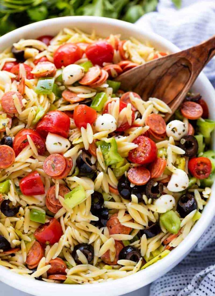 Classic Italian orzo pasta salad, complete with a homemade dressing and mini pepperonis. This traditional American pasta salad is great with an orzo pasta twist.