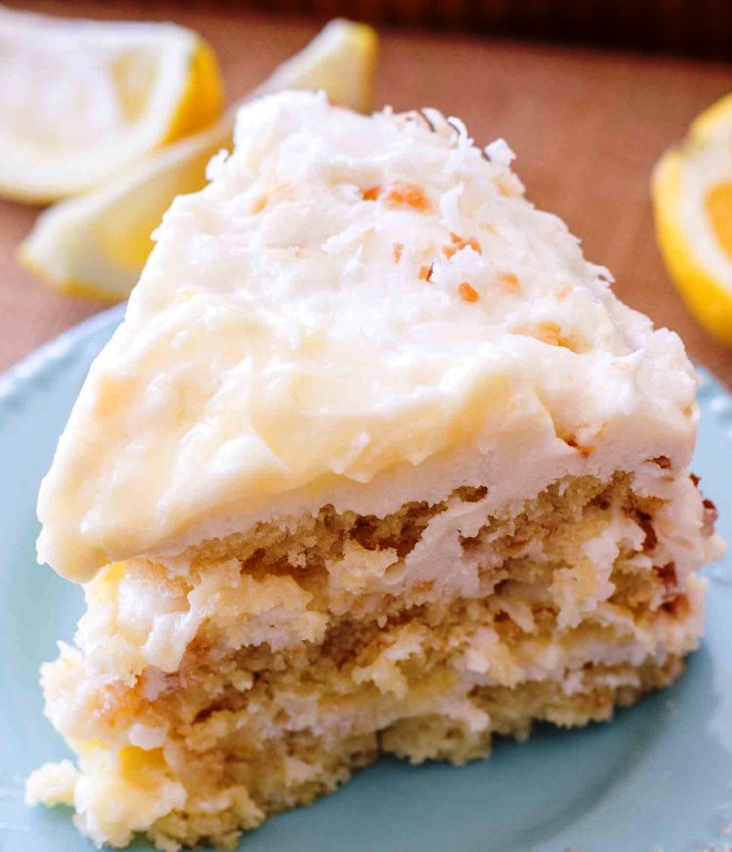 This homemade Lemon Coconut Cake has three layers of coconut cake, homemade lemon curd and lemon cream cheese frosting. My favorite Easter dessert.