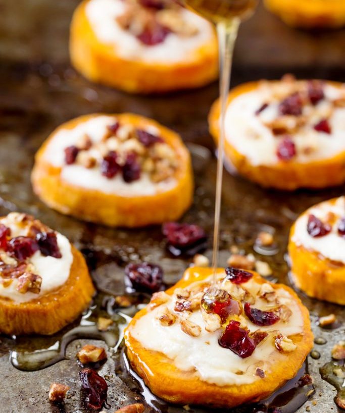 This appetizer is beautiful and delicious to make topped with creamy goat cheese, crunchy pecans, sweet dried cranberries and drizzled with honey.