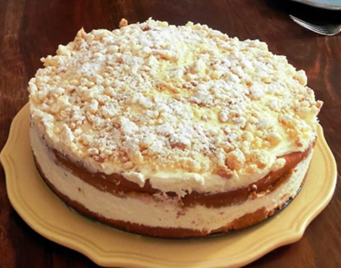 Olive Garden Inspired Lemon Cream Cake is a light white cake with a creamy lemon, cream cheese and whipped cream filling garnished with a crumb topping. Serve chilled for a refreshing dessert.