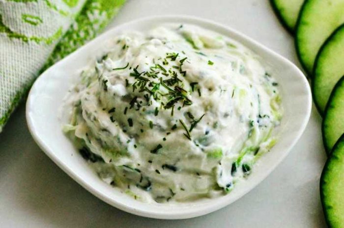 This easy tzatziki sauce is made with Greek yogurt, sour cream and fresh dill! It's thick and creamy (not watery) and so delicious! It perfectly compliments Mediterranean dishes, and makes a great party dip