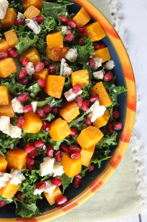In this salad recipe, chopped kale is tossed with roasted butternut squash, blue cheese, pomegranate seeds and a honey-cider vinaigrette. It’s such a simple salad.