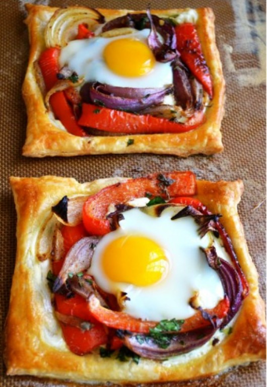 These baked egg galettes are much better than plain and boring fried egg. These are also loaded with sour cream, bell peppers, onions and savory herbs and spices. The flaky puff pastry filled with all the tastiness of veggies and perfectly baked eggs will bring you tons of palatable tastes. 
