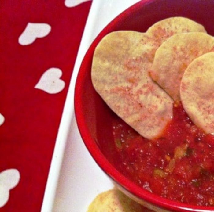 Valentine’s Day Tortilla Chips. Perfect to involve your little chef in making the chips and transforming a tortilla into a puff crispy Valentine Tortilla heart. Get ready for a very fun and edible addition to salsa and chips.