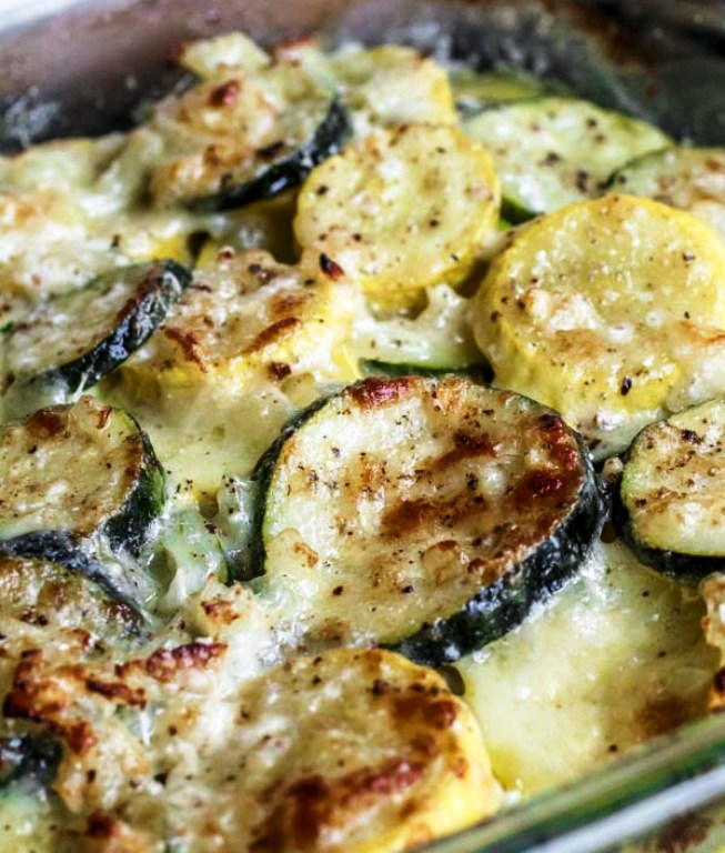 This creamy, cheesy Baked Zucchini Casserole is made with fresh zucchini, rich cream, and lots of cheese! It is an easy keto zucchini recipe that everyone will love.