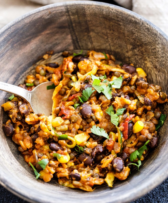 A healthy, vegetarian, gluten free dinner the whole family will love! You won’t miss the meat in this easy to make, One Pot Cheesy Mexican Lentils, Black Beans and Rice.