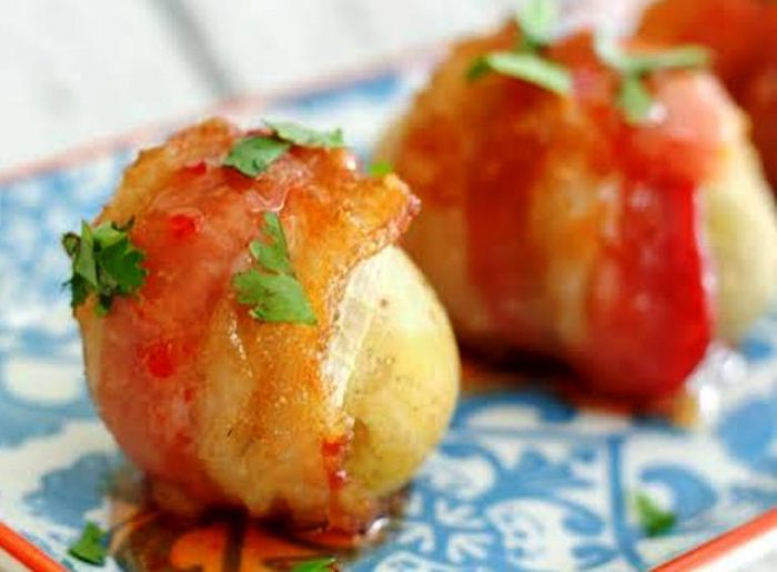 you're going to want to double or triple this recipe because these potato bites are so good. From the smoky and sweet candied bacon to the sweet and spicy sauce and the creamy potatoes, you really taste each individual ingredient in every bite.