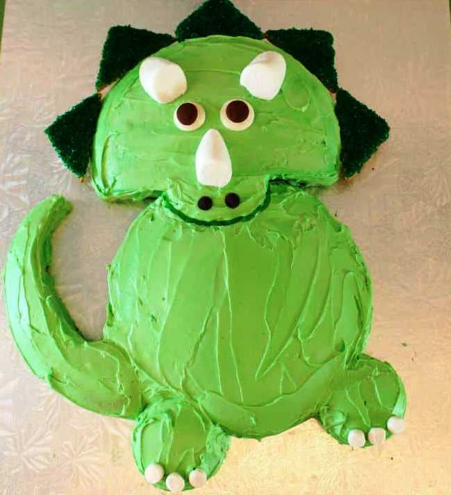 I enjoy making birthday cakes. Sure you can go out and buy a cake, but why do that when you create your own easy dinosaur cake.