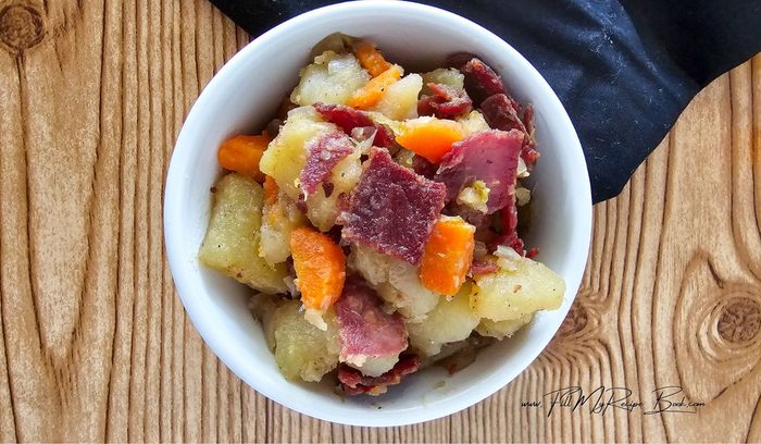 Homemade easy corned beef hash recipe with vegetables cooked in a slow cooker, then fry the corned beef and add it to the dish for for a meal.
