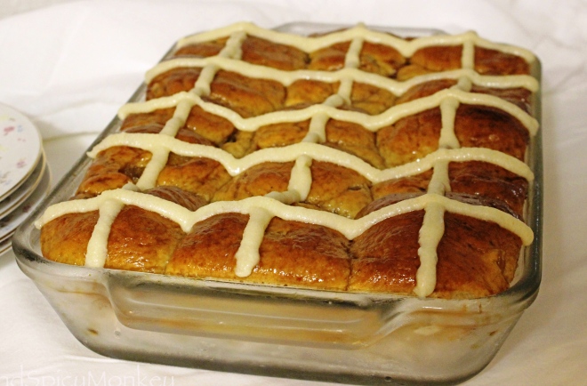 Using candied pineapple wedges to create this recipe for Pineapple Hot Cross Buns. 