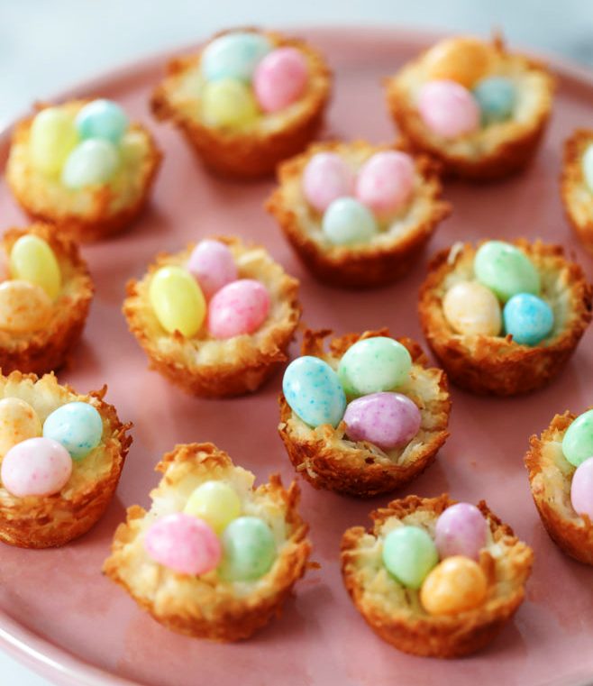 These Coconut Macaroons shaped into nests and garnished with candy eggs are a delicious, sweet, and easy spring dessert. Or easter dessert.