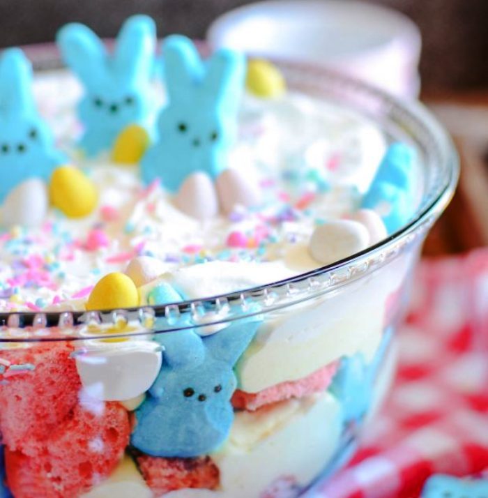 A sweet and easy Easter trifle made with pink velvet cake, cheesecake mousse, and Peeps marshmallows.