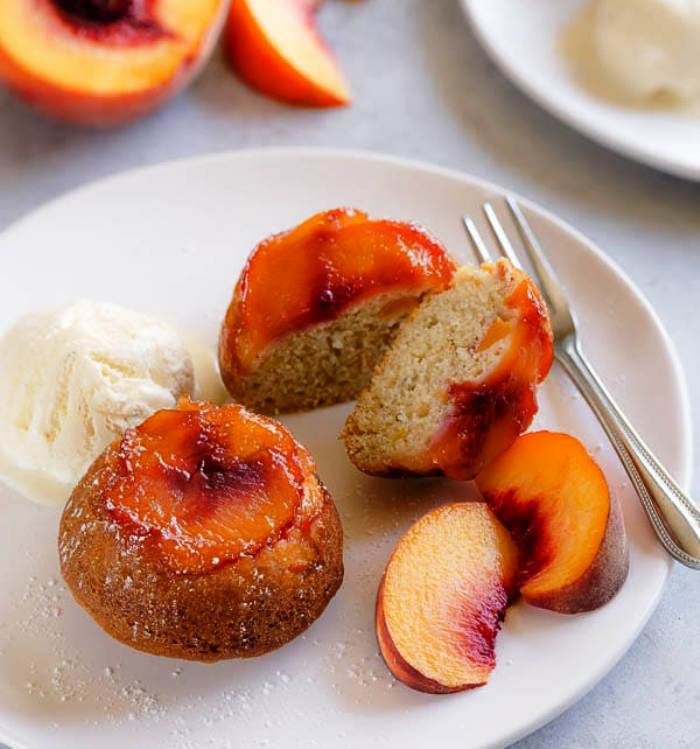 These super moist and tender peach upside down mini cakes are bursting with peaches in every bite. Easy to make, this recipe is a keeper for that indulgent peach season!