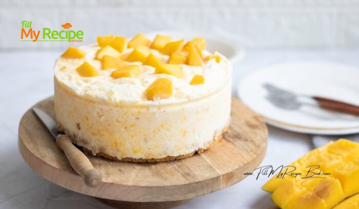 Easy Mango Cheesecake Dessert recipe. No gelatin, cream cheese and lemon and biscuit base. No Bake creamy filling, decorated mango slices.